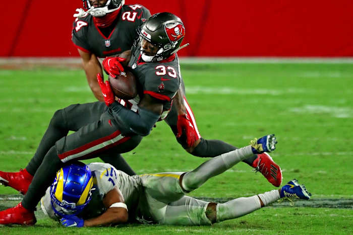 Tampa Bay free safety Jordan Whitehead (33) intercepts a pass intended for Rams receiver Robert Woods (17). Mandatory Credit: Kim Klement-USA TODAY Sports